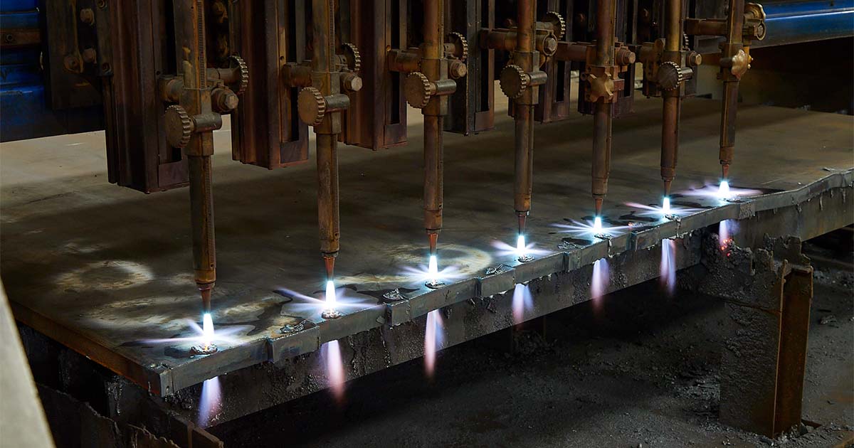 Row of flame cutters